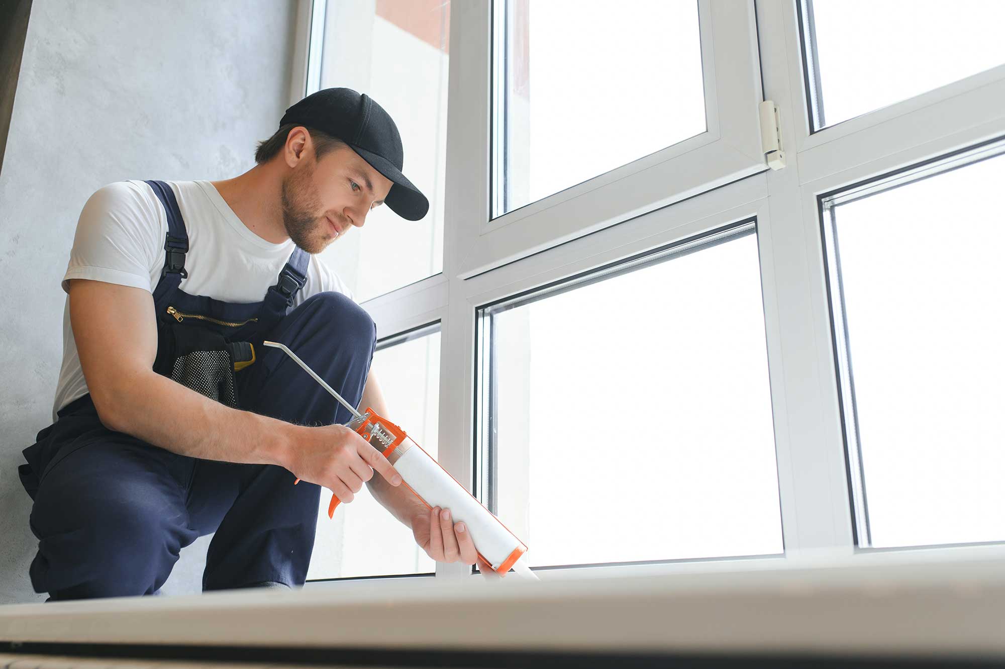 Window installation process showing sealing and alignment to prevent air leaks.